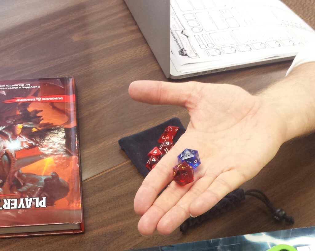 role play dice in hand