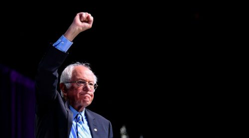 Bernie Sanders with his fist upraised. 