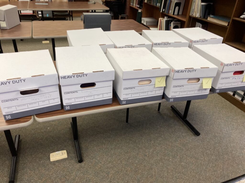 Archive boxes sitting on a desk in a library